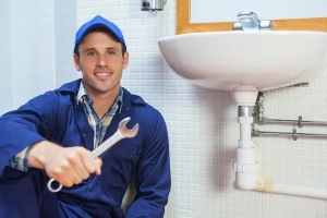 Plumber fixing a kitchen sink in a Santa Rosa home