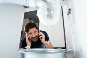 Worried Man Calling Plumber