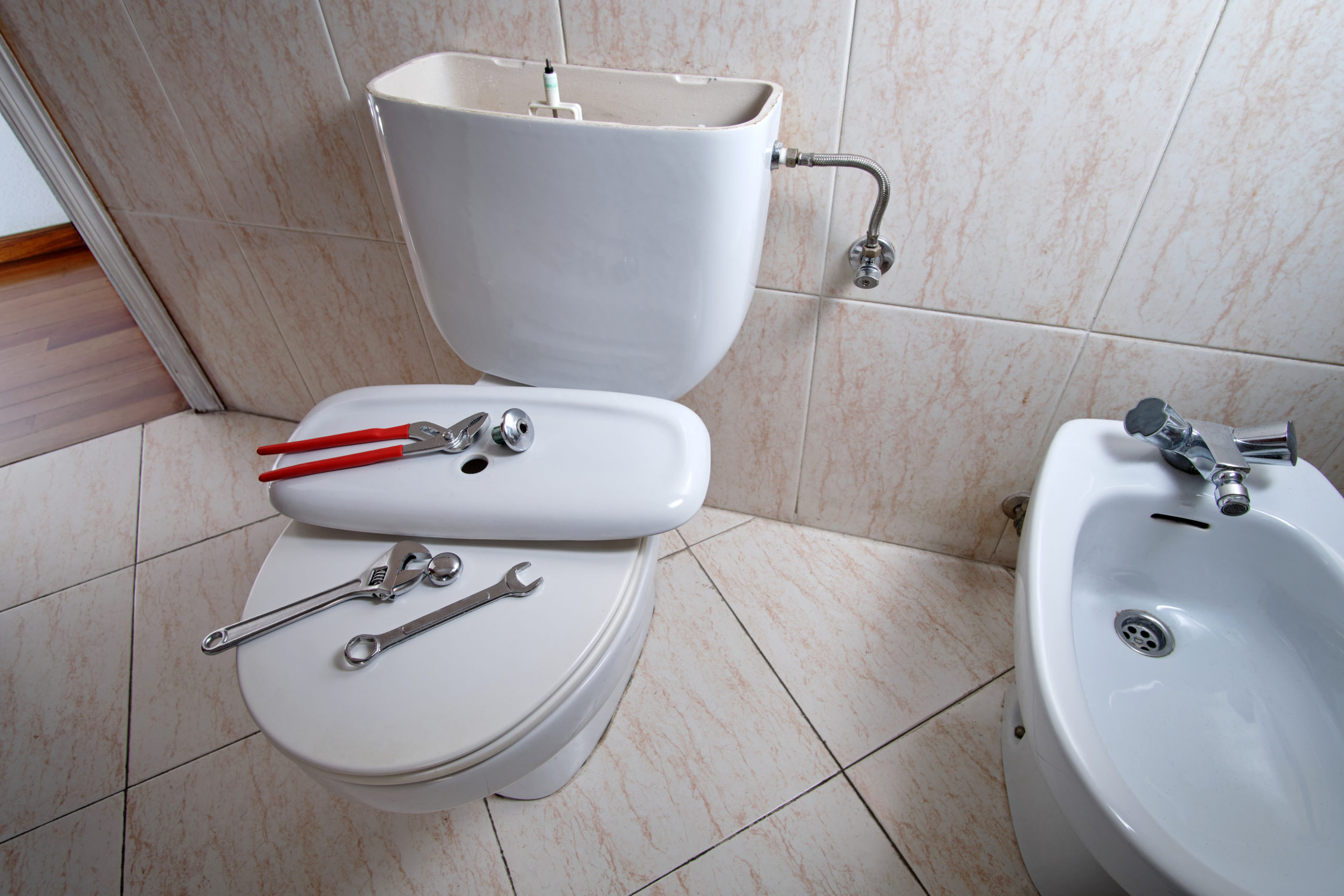 Cracked toilet bowl being replaced by a Super Service Plumbing in Santa Rosa