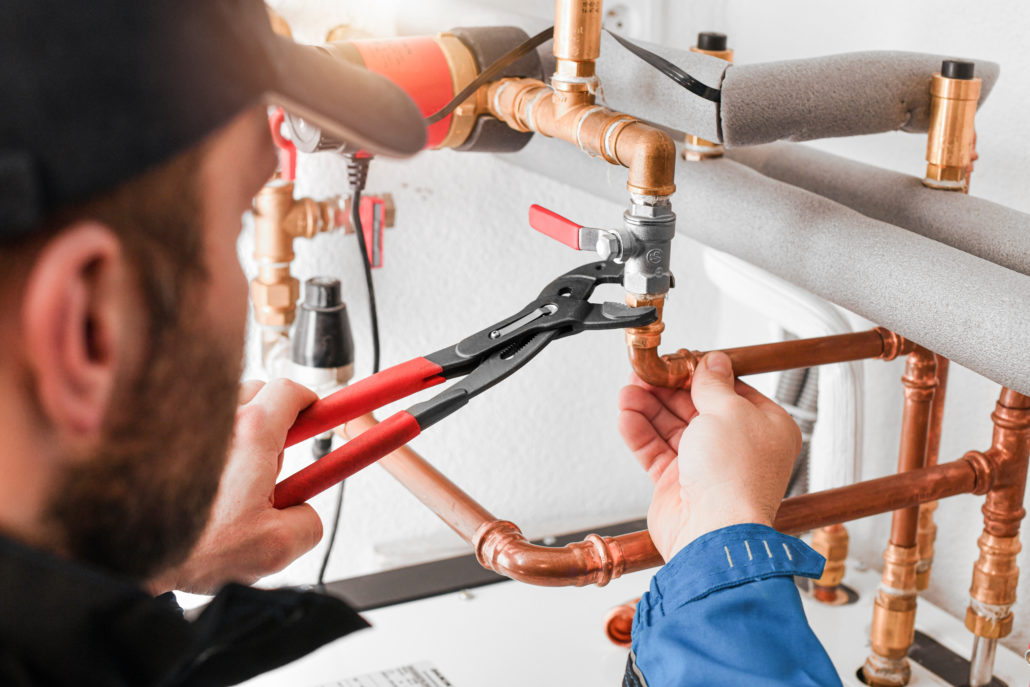 Plumber inspecting damaged pipes to determine if repair or replacement is needed in Santa Rosa, CA.