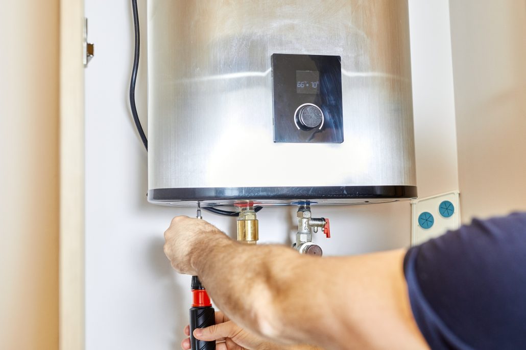 Professional installation of a tankless water heater in a residential home.