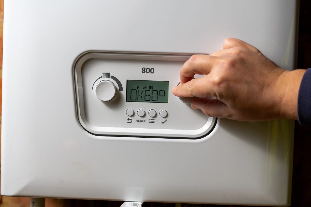 Side-by-side comparison of a traditional water heater and a tankless unit.